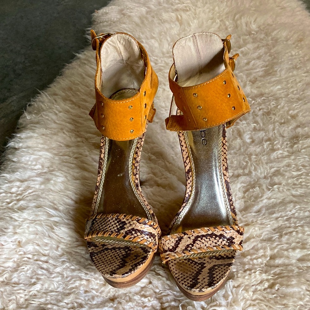 Bebe sexy heels in snake skin and yellow suade. Size 7